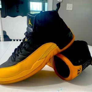 Air Jordan 12 black and yellow, size 14.  Good used condition!